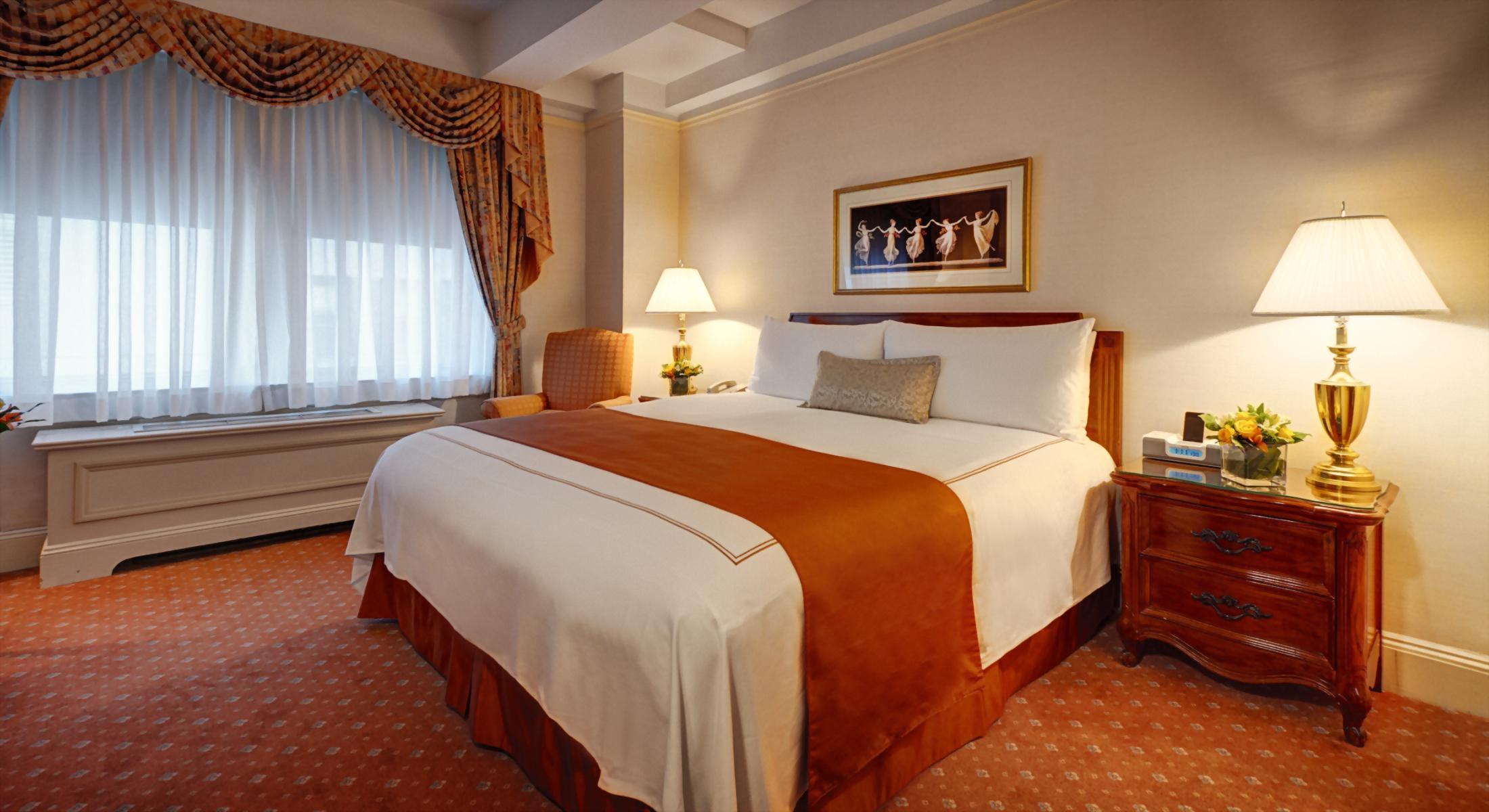 Deluxe King Room at the Hotel Elysee with 1 King Bed.  Approximately 300 square feet and comfortable for up to 2 adult guests.