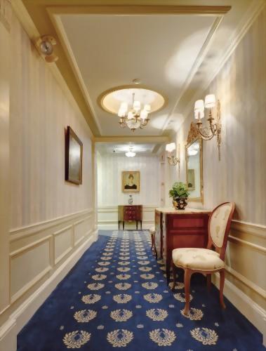 Elegant hallways of the Hotel Elysee New York by Library Hotel Collection lead to guest rooms.