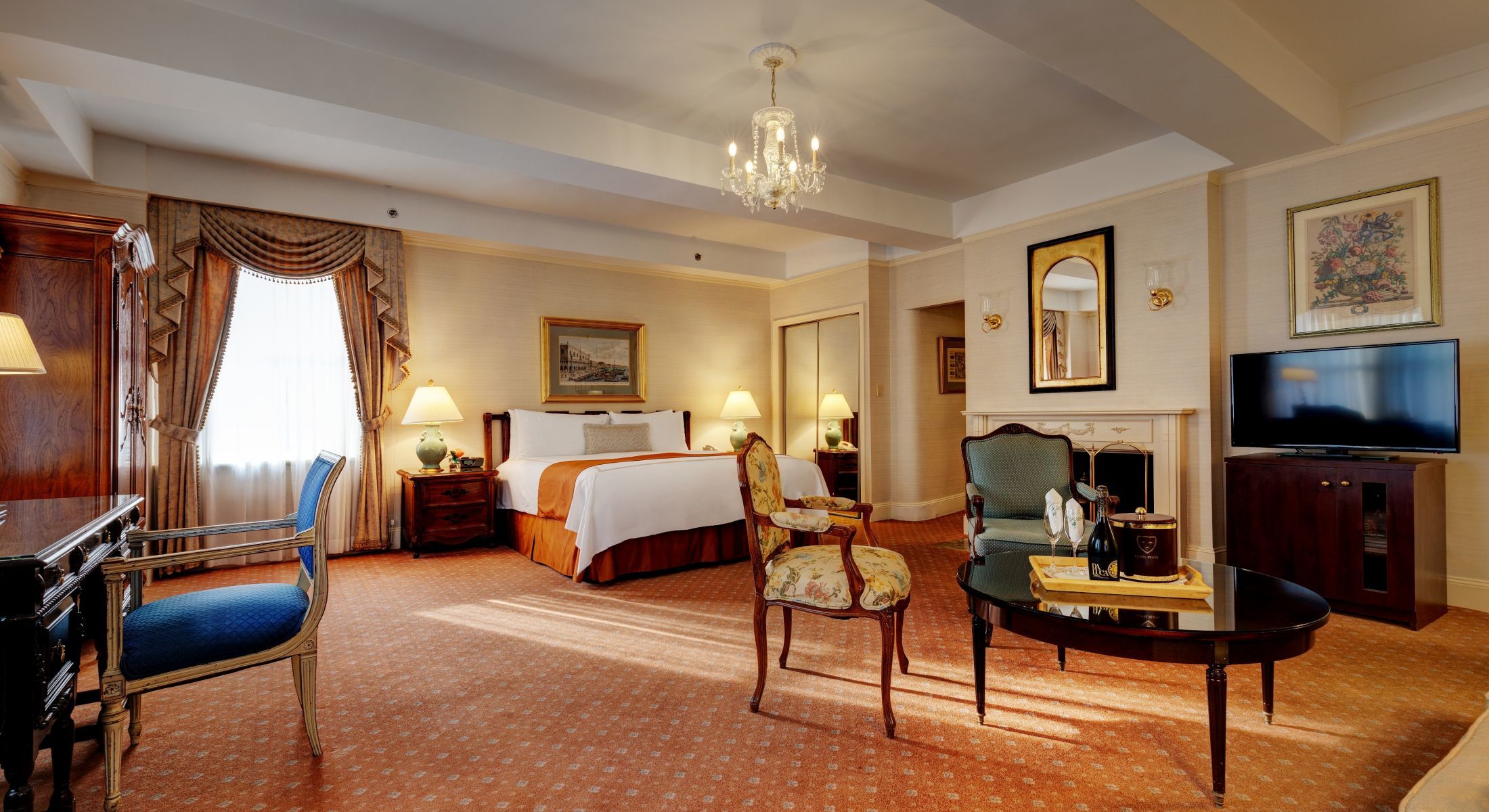 Beautiful Junior Suites at the Hotel Elysee feature faux fireplaces and two televisions